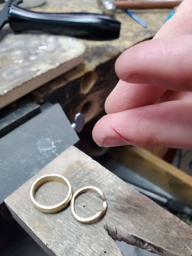 Elopement wedding rings made with blood, sweat, and tears in 14K yellow gold.