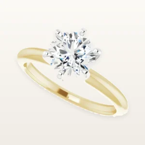 Handmade 14K gold solitaire engagement ring with a round moissanite center stone, made at the LaProng workshop in Dallas