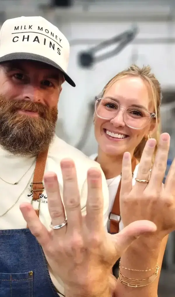 Couple showing the wedding rings they made for each other